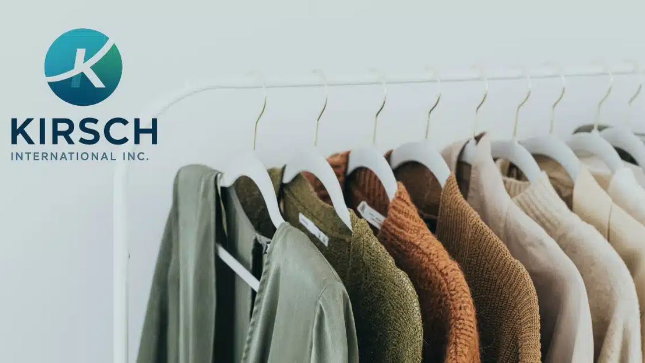 Kirsch International logo beside a rack of apparel